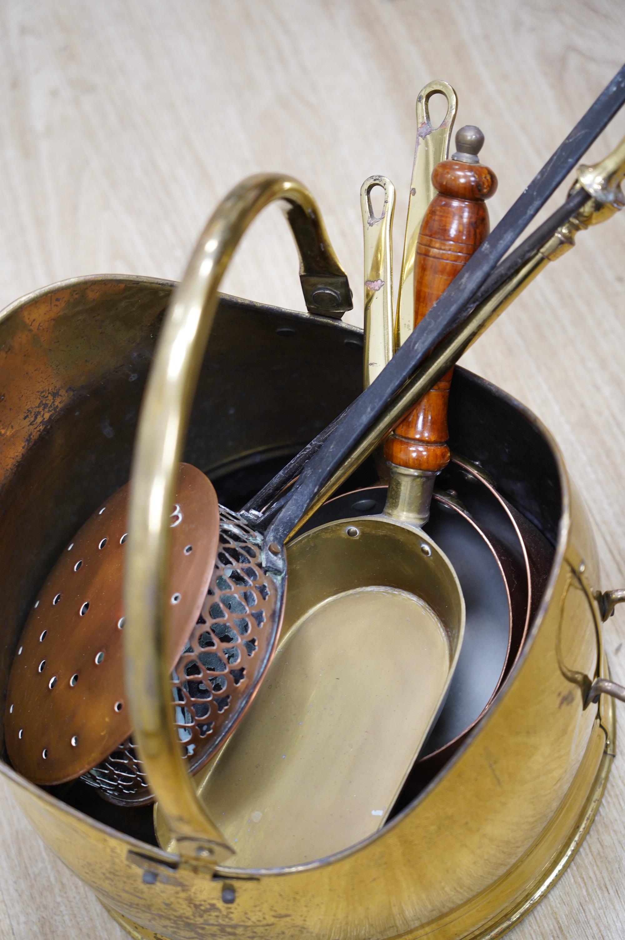 A quantity of copper and brass ware to include coal scuttle and warming pan. Condition - fair to good